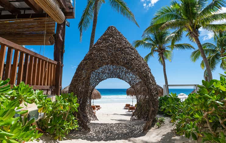 Ana y Jose nest‑like structure, beach, palm trees, tropical design, bohemian luxury