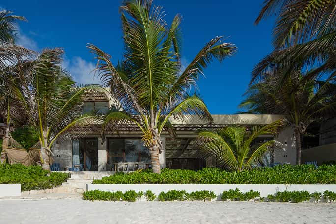 oceanfront villa, private pool, terrace with wooden table, palm trees, ocean views, luxury Casa Agua Ana y Jose